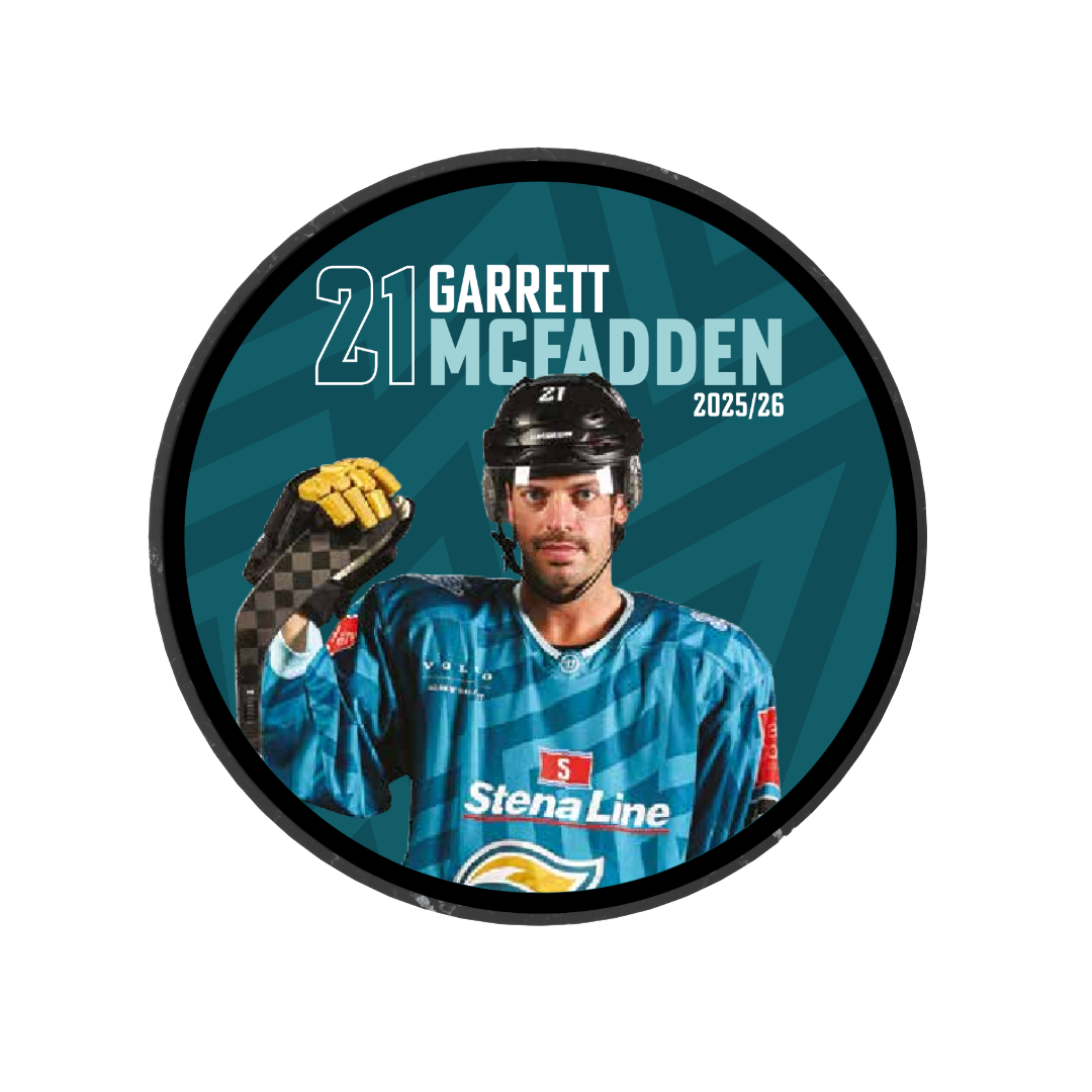 The Belfast Giants 2025-26 Player Puck showcases Garrett McFadden (#21) in his blue kit, raising a gloved hand, with "GARRETT MCFADDEN 21," "2025/26," and the Stena Line logo on his jersey in the background.