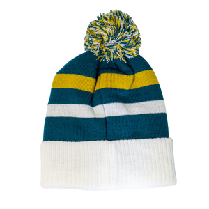 The Belfast Giants Hockey Beanie Off-White by Belfast Giants features a pom-pom, blue, yellow, and white stripes, plus a wide folded brim—ideal for staying cosy on winter matchdays.