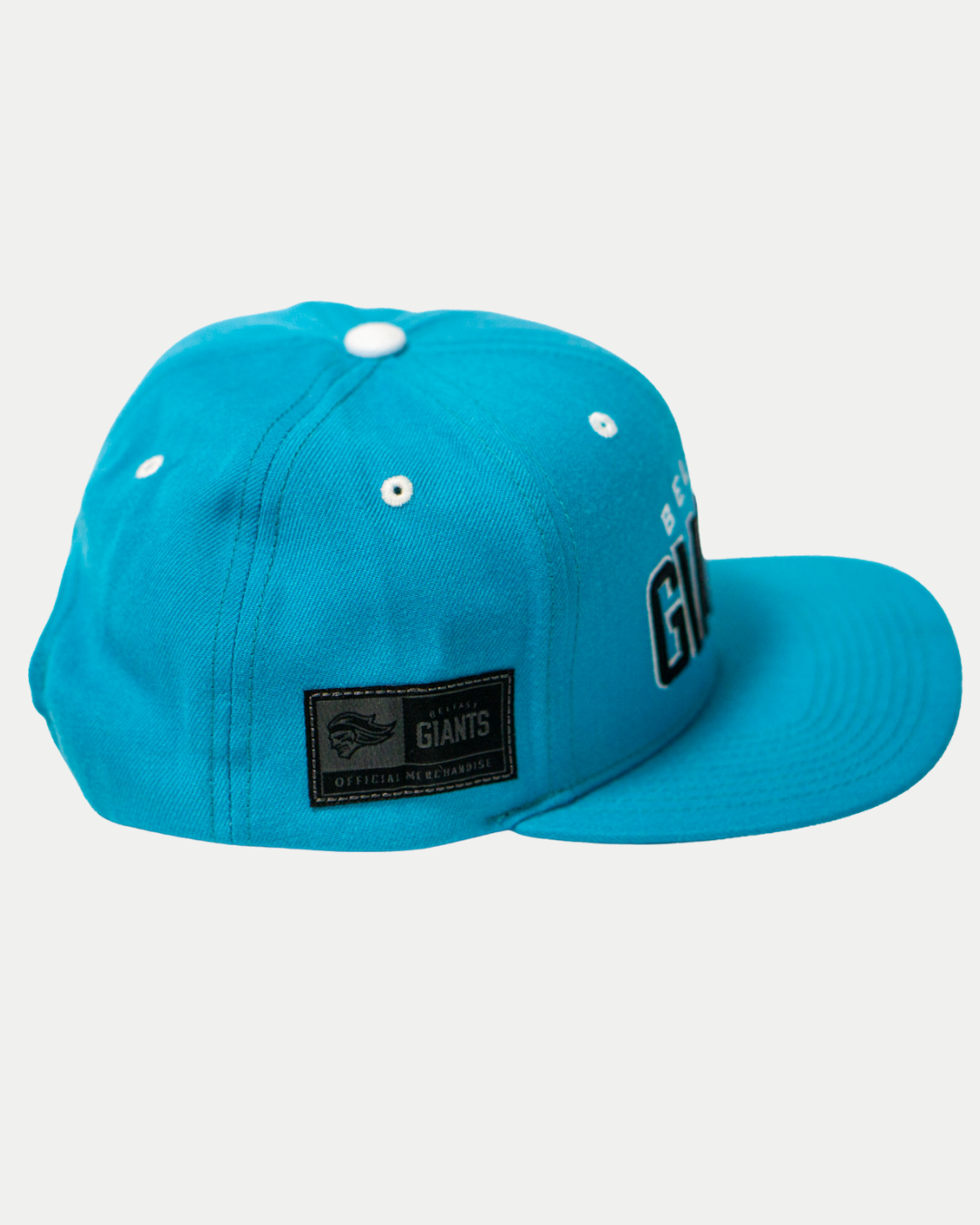 The Belfast Giants Teal Snapback Cap features a flat brim, team crest patch, and ventilation eyelets. This bold teal baseball cap by Belfast Giants is shown against a plain white background.