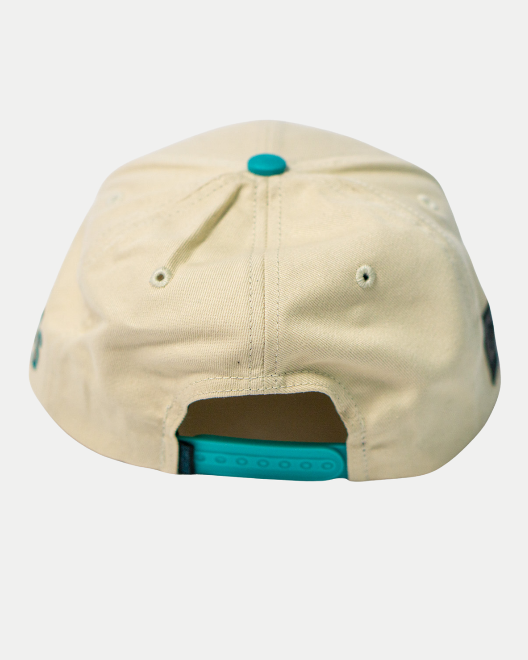 The Belfast Giants Hockey Cap Off-White by Belfast Giants features an adjustable blue snapback closure, metal eyelets for ventilation, and a stylish off-white design—ideal as a casual sports hat.