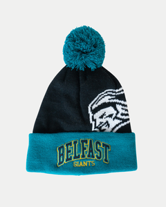 The Belfast Giants 25-26 Beanie Arched Logo from Belfast Giants Store by National Merchandise features a teal pom-pom and cuff, yellow and green BELFAST GIANTS embroidery, a black base, and a white giant’s face on the side.