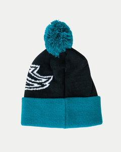 The Belfast Giants 25-26 Beanie Arched Logo from Belfast Giants Store by National Merchandise is a black knit beanie with a teal cuff, teal pom-pom, and a partial white graphic on one side—perfect for the 2025-2026 season.