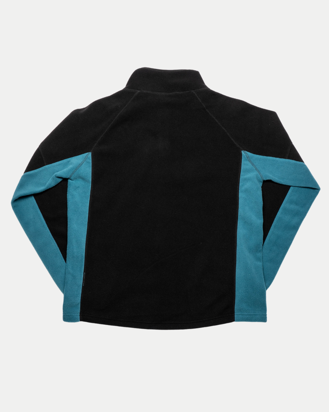 The Belfast Giants Fleece Half Zip Black is a streetwear-inspired jacket with teal sleeves and side panels, a black main body, long sleeves, high collar, and no visible fasteners. Shown from the back. Brand: Belfast Giants.