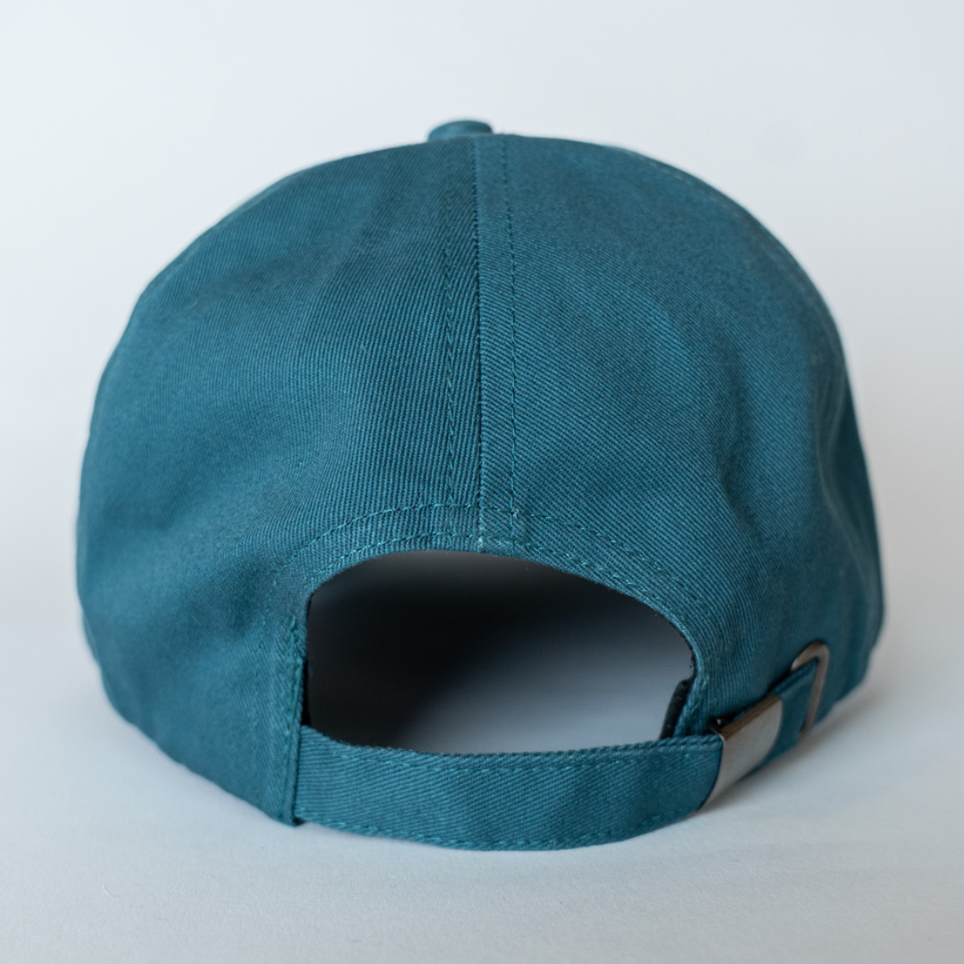 The Belfast Giants Cap Teal and White Brim, by Belfast Giants, is shown from the back with an adjustable strap and metal buckle, set against a plain light background.