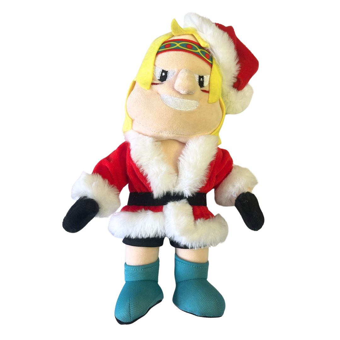 The Belfast Giants Mascot Santa Finn Plush Toy from Belfast Giants Store by National Merchandise features yellow hair, a red Santa hat and coat, black gloves, blue boots, a colorful headband, and a wide smile with cartoon-like features.