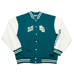 The Belfast Giants Varsity Jacket Teal features striped cuffs and collar, WE ARE GIANTS on the left chest, the Belfast Giants BG logo on the right, and GIANTS printed vertically down the right sleeve.