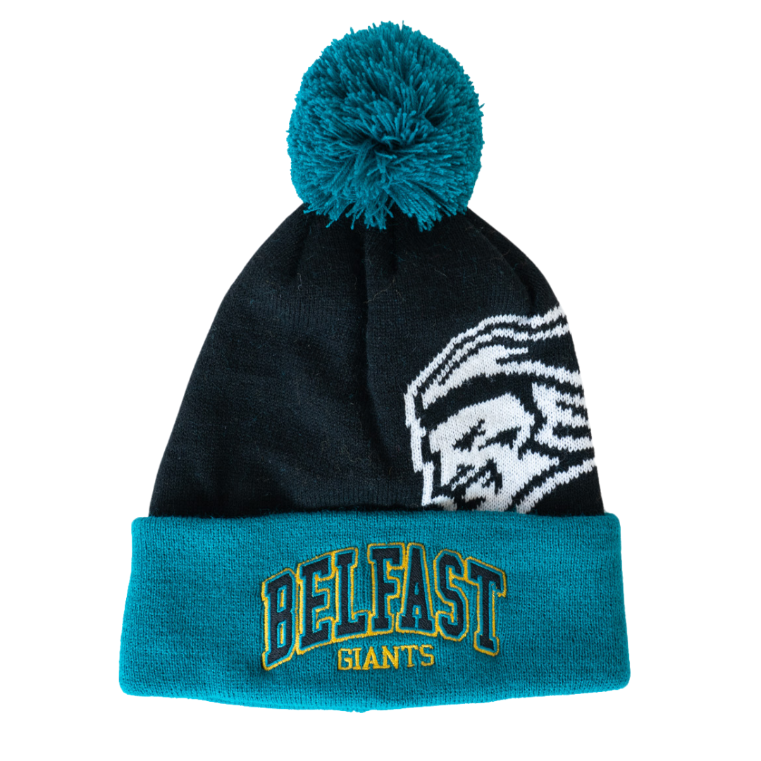 The Belfast Giants 25-26 Beanie Arched Logo features black and teal knit, a pom-pom, a stylized white face on one side, and BELFAST GIANTS embroidered in yellow and teal on the folded brim. Available at Belfast Giants Store by National Merchandise.