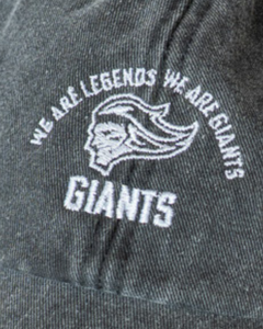 Close-up of dark fabric with white embroidered text "WE ARE LEGENDS WE ARE GIANTS," above the GIANTS logo, showcasing the classic Belfast Giants Made To Order Vintage Dad Hat.