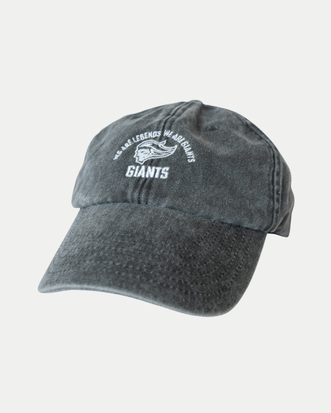 The Made To Order Giants Vintage Dad Hat by Belfast Giants features white embroidered “WE ARE LEGENDS WE ARE GIANTS” and “GIANTS” text with a handshake on faded black 100% brushed washed cotton for a true vintage look.