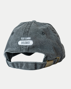 The Made To Order Giants Vintage Dad Hat by Belfast Giants features a faded black look, 100% brushed washed cotton, an adjustable strap with metal clasp, and white embroidered EST 2000 and BELFAST text on the back for authentic vintage style.
