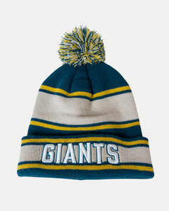 The Belfast Giants Beanie Cream/Teal features cream, teal, and yellow knit, a pom-pom on top, and "GIANTS" embroidered in bold white and blue letters on the front cuff.