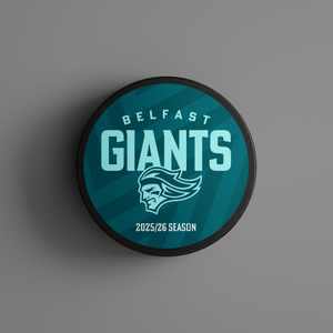 The Logo Season Puck Text 25-26 from Belfast Giants Store by National Merchandise is a teal ice hockey puck with Belfast Giants, a giant head logo, and 2025/26 Season on a chevron-patterned background.
