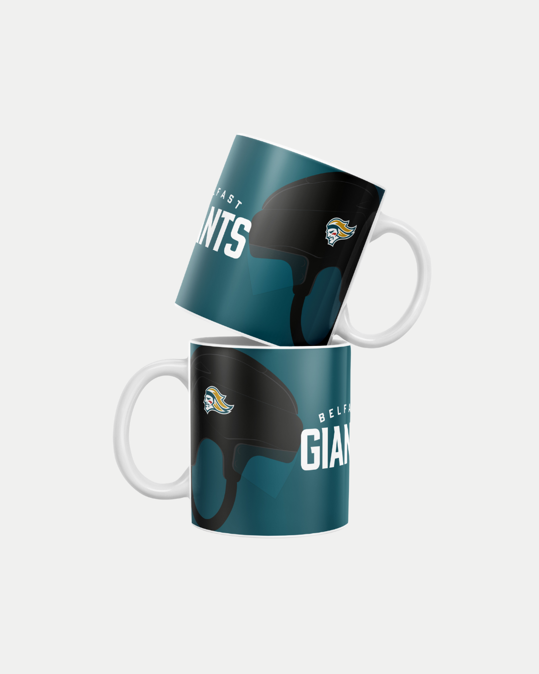 Two teal Belfast Giants Helmet Mugs with white handles and black hockey helmet design, arranged with one upright and one leaning atop. Made to order to reduce waste; delivery details at checkout.