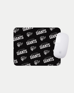 The Belfast Giants Multiple Logo Black Mousemat features a repeating white Belfast Giants text and logo pattern on black, shown with a white Apple Magic Mouse. Made to order for quality and reduced waste. Brand: Belfast Giants.