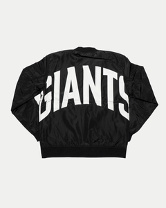 The Belfast Giants Bomber Jacket Black Backprint by Belfast Giants is a black bomber jacket featuring large, bold white "GIANTS" lettering across the back, shown here displayed flat.
