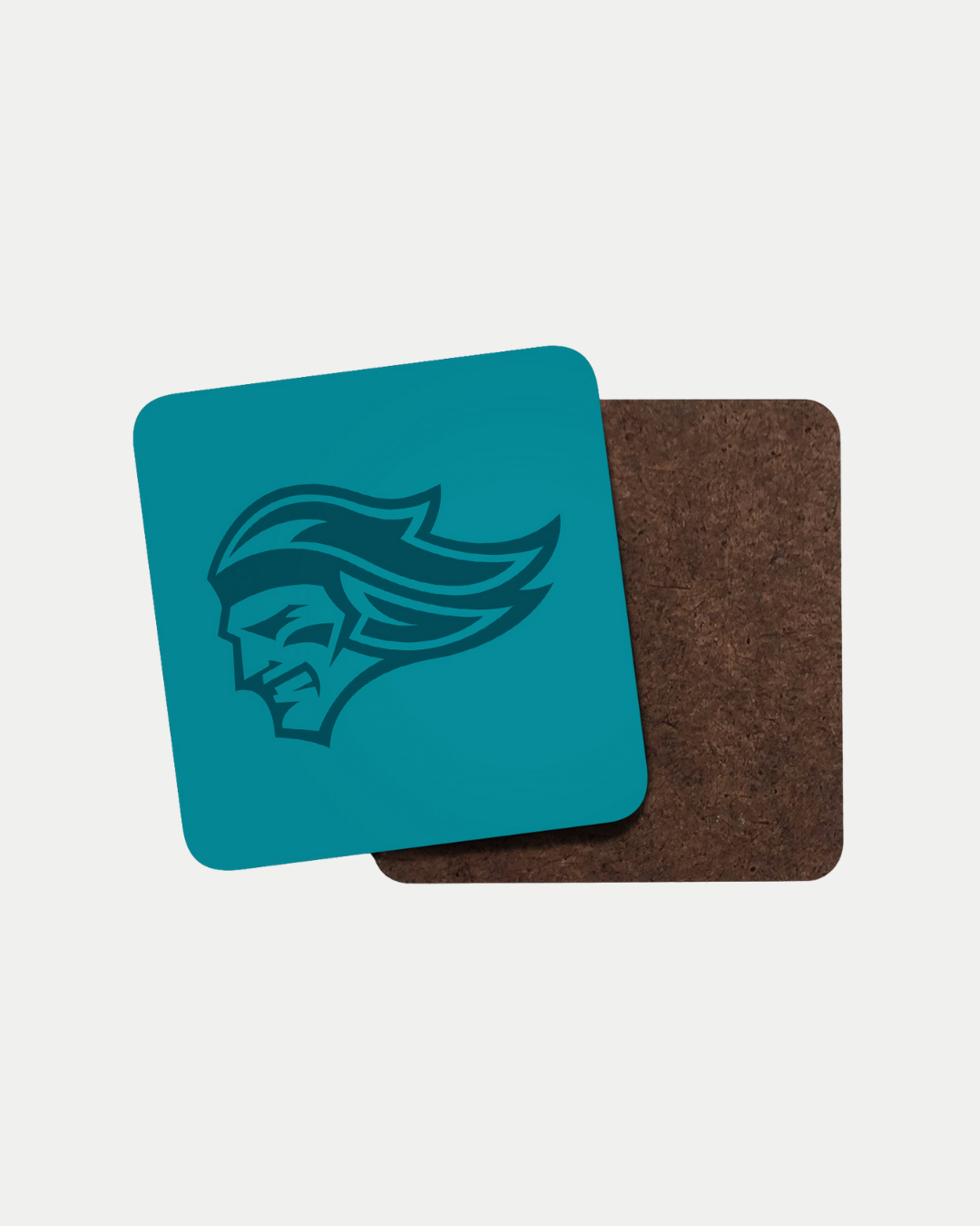 The Belfast Giants Logo Teal Coaster by Belfast Giants features a stylized, dark blue helmeted figure with flowing hair on a teal square, shown atop a brown coaster. Made to order to reduce waste, photographed against a plain white background.