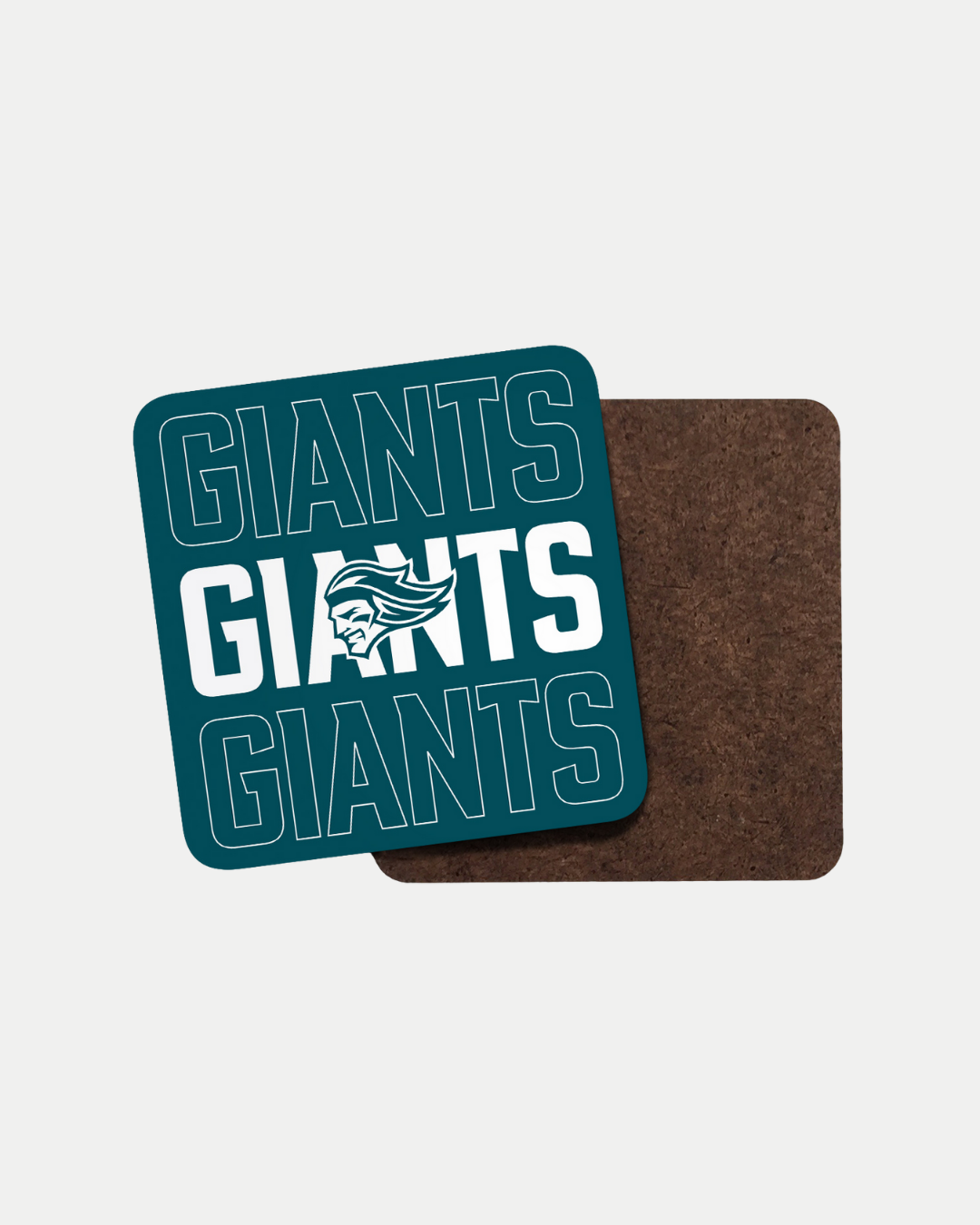 The Giants Giants Giants Teal Coaster by Belfast Giants features “GIANTS” in bold teal and white with a stylized mascot head at the center. Made to order to help reduce waste, it's shown displayed atop a plain brown coaster.