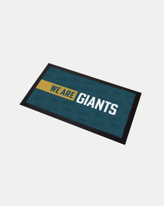 The Belfast Giants We Are Giants Bar Runner features bold white and yellow text on a blue background with a subtle GIANTS pattern and dark border, crafted to order for reduced waste.