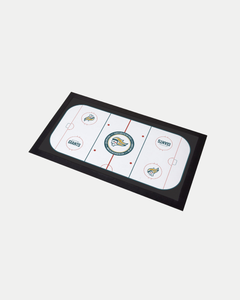 The Belfast Giants Rink Bar Runner by Belfast Giants is a rectangular, made-to-order mat with a hockey rink design—center ice, goal creases, red and blue lines, team logos on a white background, and a black border—crafted to help reduce waste.