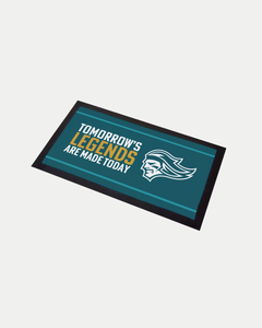 The Belfast Giants Tomorrows Legends Are Made Today Bar Runner features a teal background, bold text, and a helmeted profile. This made-to-order mat has a black border to help reduce waste.