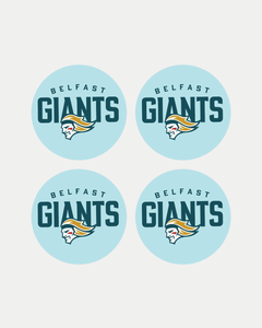 The Belfast Giants set of 4 puck coasters features identical circular logos on a light blue background, with "Belfast Giants" above a stylized bearded helmeted figure in vibrant yellow, teal, and red accents.