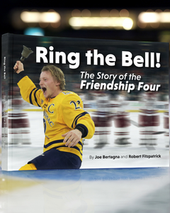 A hockey player in yellow celebrates on ice as the book "Ring the Bell! The Story of the Friendship Four" by Belfast Giants captures this one-of-a-kind college ice hockey tournament.