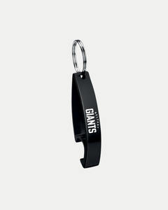 The Belfast Giants Core Bottle Opener Keyring is a black metal keychain with "BELFAST GIANTS" in white, attached to a silver keyring, shown against a light grey background.