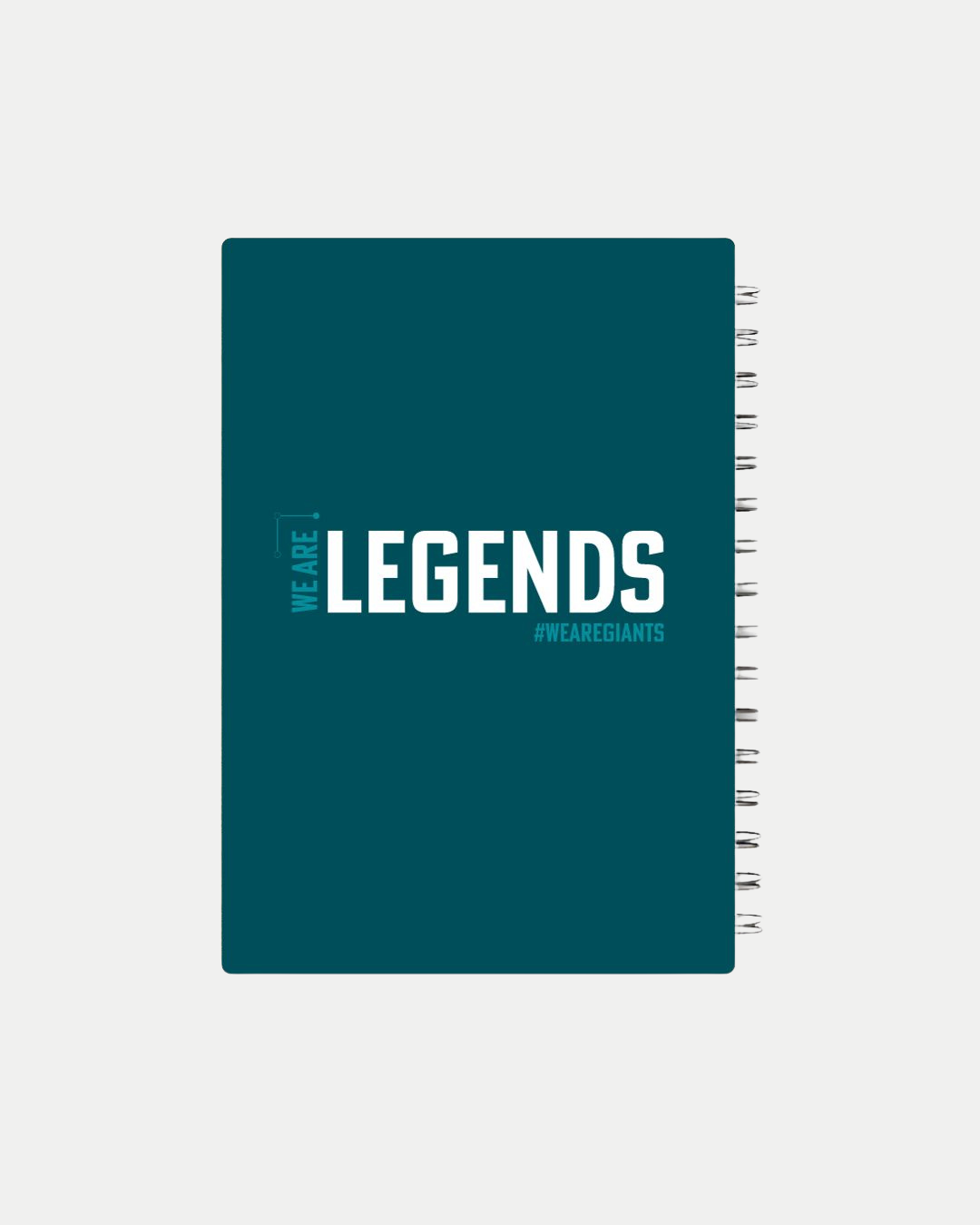 The Belfast Giants Core A5 Notebook features a teal cover with "WE ARE: LEGENDS" in bold white text and "#WEAREGIANTS" below, set against a plain white background.