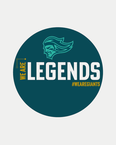 A circular We are Legends Puck by Belfast Giants features a teal background, stylized head logo, bold “WE ARE LEGENDS” in white and yellow, and a vibrant yellow #WEAREGIANTS hashtag.