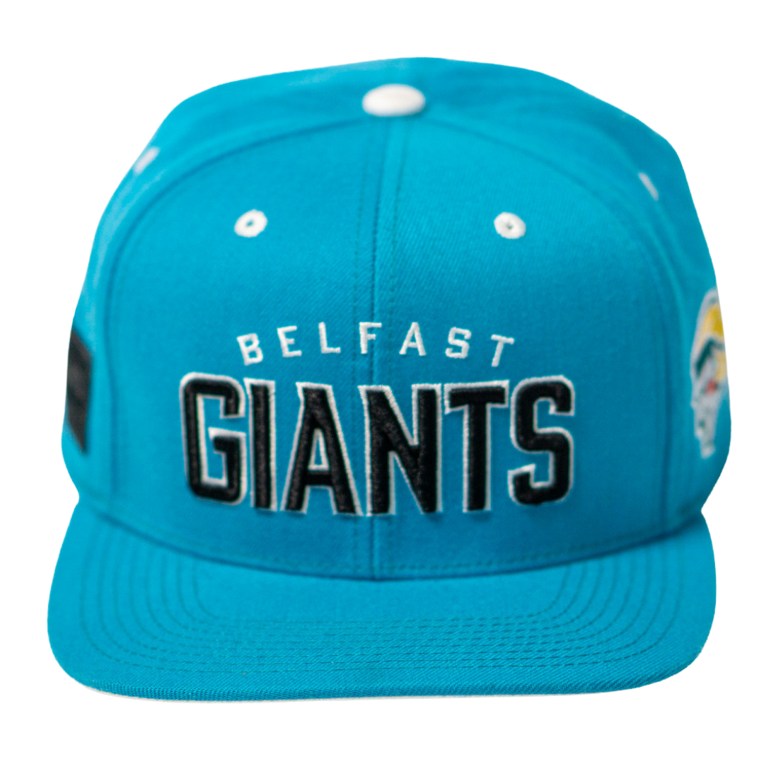 The Belfast Giants Teal Snapback Cap features GIANTS embroidered in bold black and white on the front, small white eyelets, and a colorful team crest side patch. Branded by Belfast Giants.