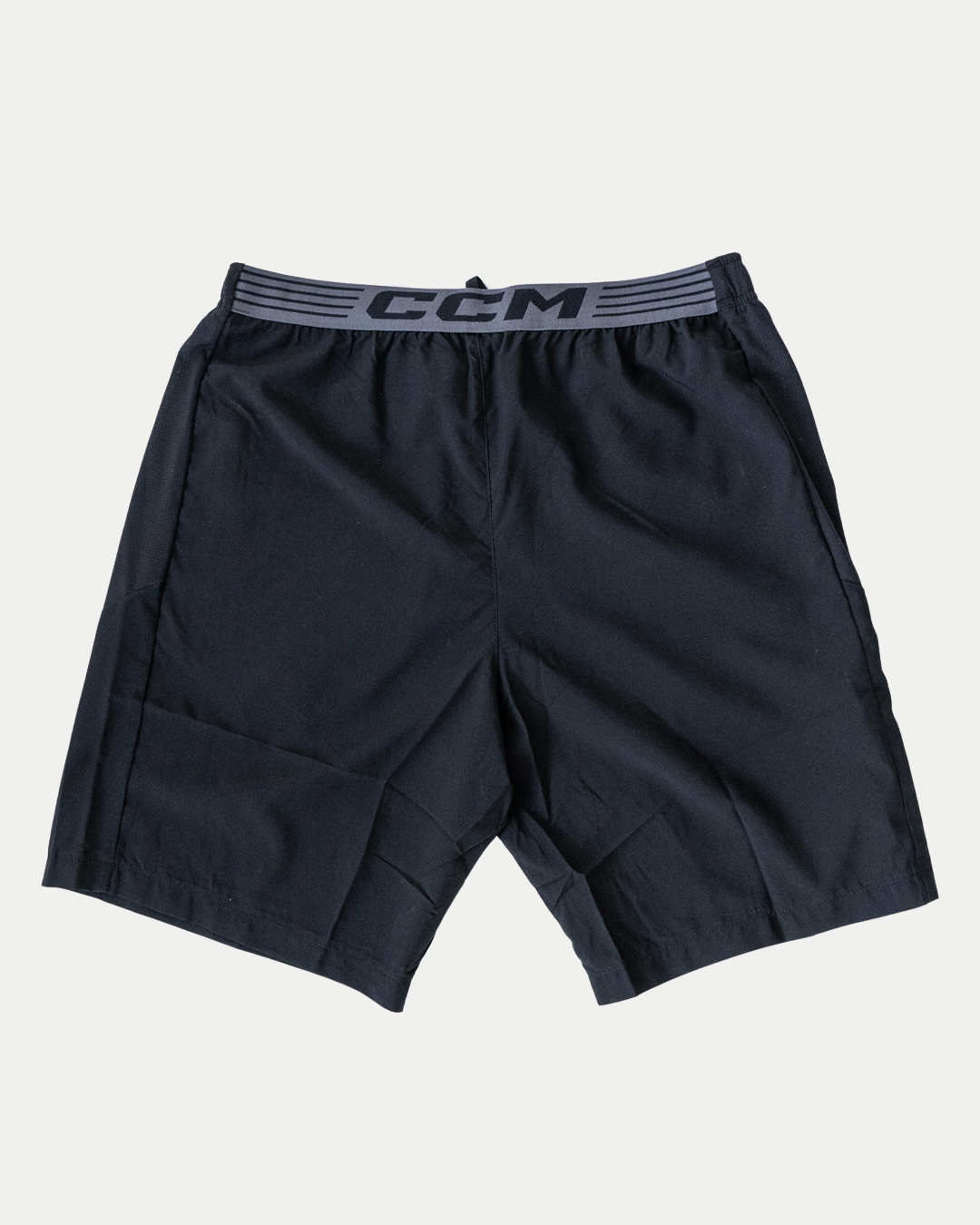 The Belfast Giants CCM Training Shorts are black athletic shorts with an elastic waistband and gray CCM branding, shown laid flat on a white background.