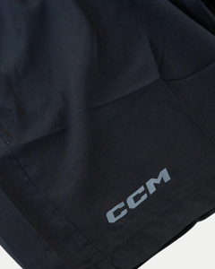 Close-up of Belfast Giants CCM Training Shorts in black, featuring the white CCM logo printed near the hem.