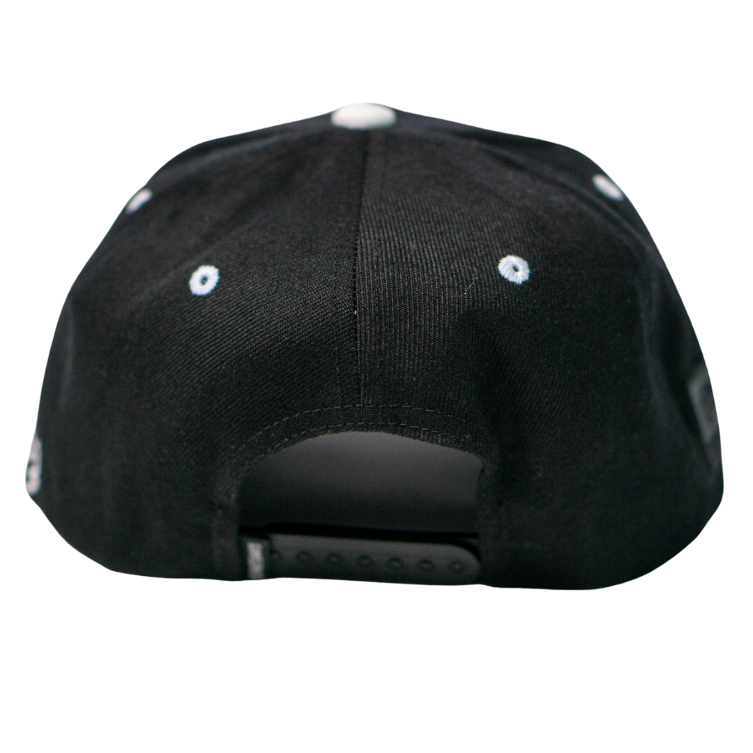 A close-up of the Belfast Giants Cap Black and White by Belfast Giants, featuring white eyelets and an adjustable snapback closure—a must-have for true supporters.