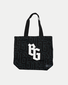 The Belfast Giants Tote Bag BG Logo by Belfast Giants is a black tote with thick handles, a bold white BG logo centered, and an all-over geometric pattern outlined in dark blue and teal.