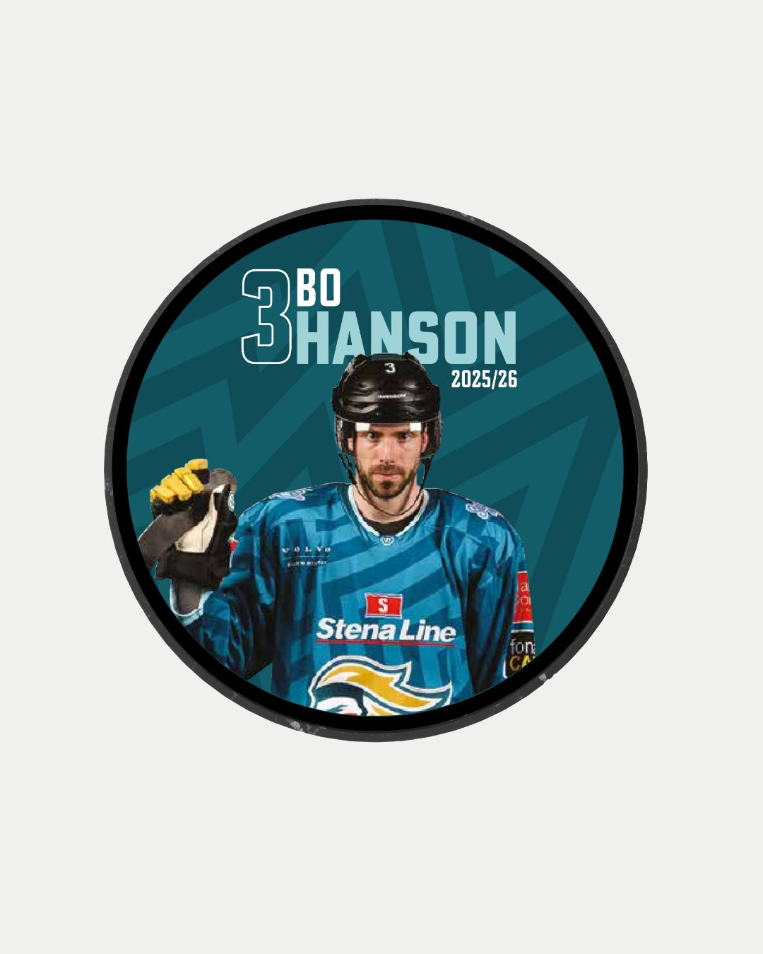 A Belfast Giants player in a blue jersey with Stena Line, black helmet, and hockey stick appears on the 2025-26 Player Puck. Text reads "3 Bo Hanson 2025/26" on teal. Ideal for fans or collectors of limited edition Belfast Giants pucks.