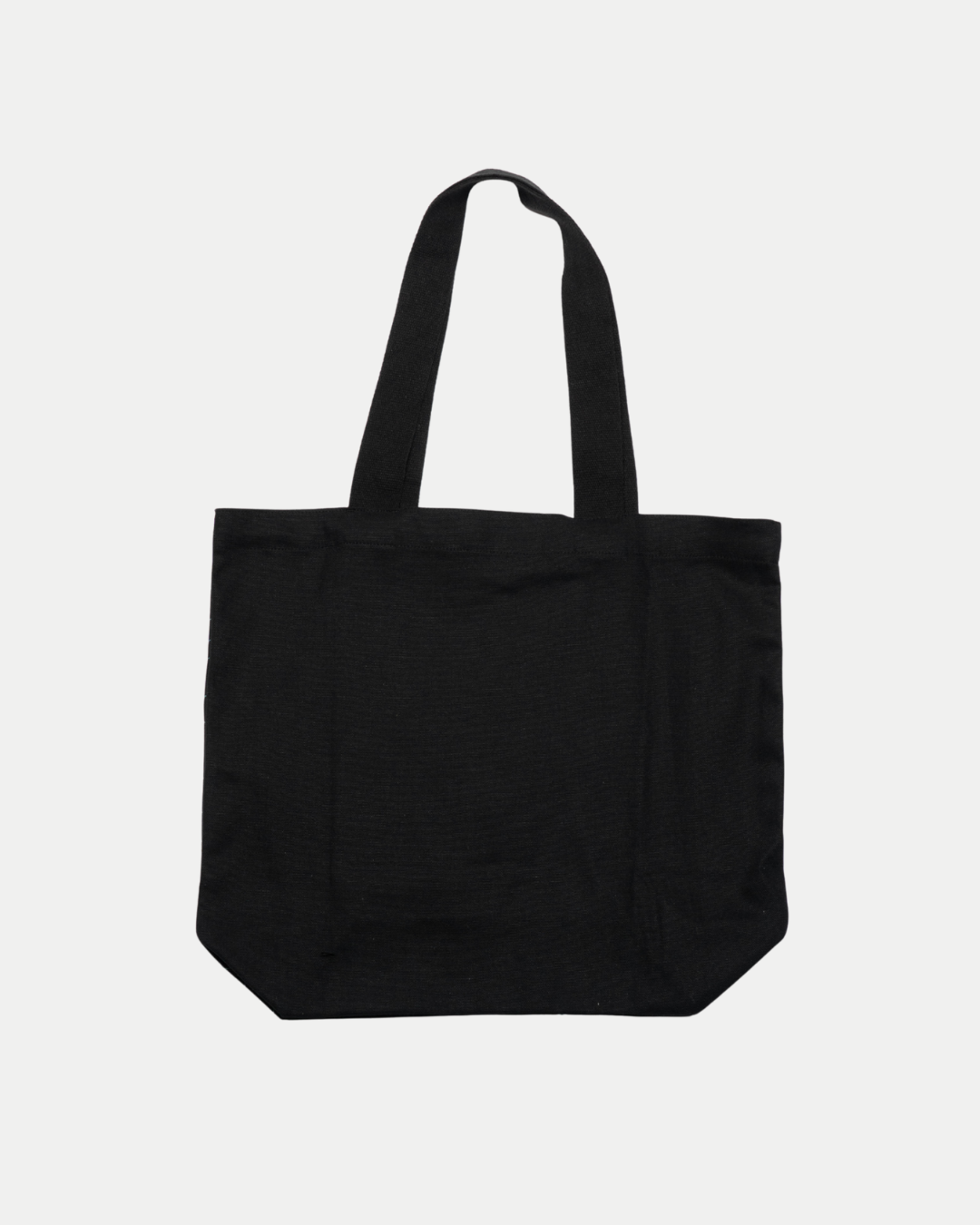 The Belfast Giants Tote Bag BG Logo is a plain black fabric tote with two handles and a subtle BG monogram, displayed against a white background.