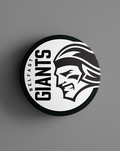 The Belfast Giants Black Logo Puck 25-26 from Belfast Giants Store by National Merchandise features the team logo, including a stylized giant’s face and bold GIANTS lettering, on a sleek black puck.