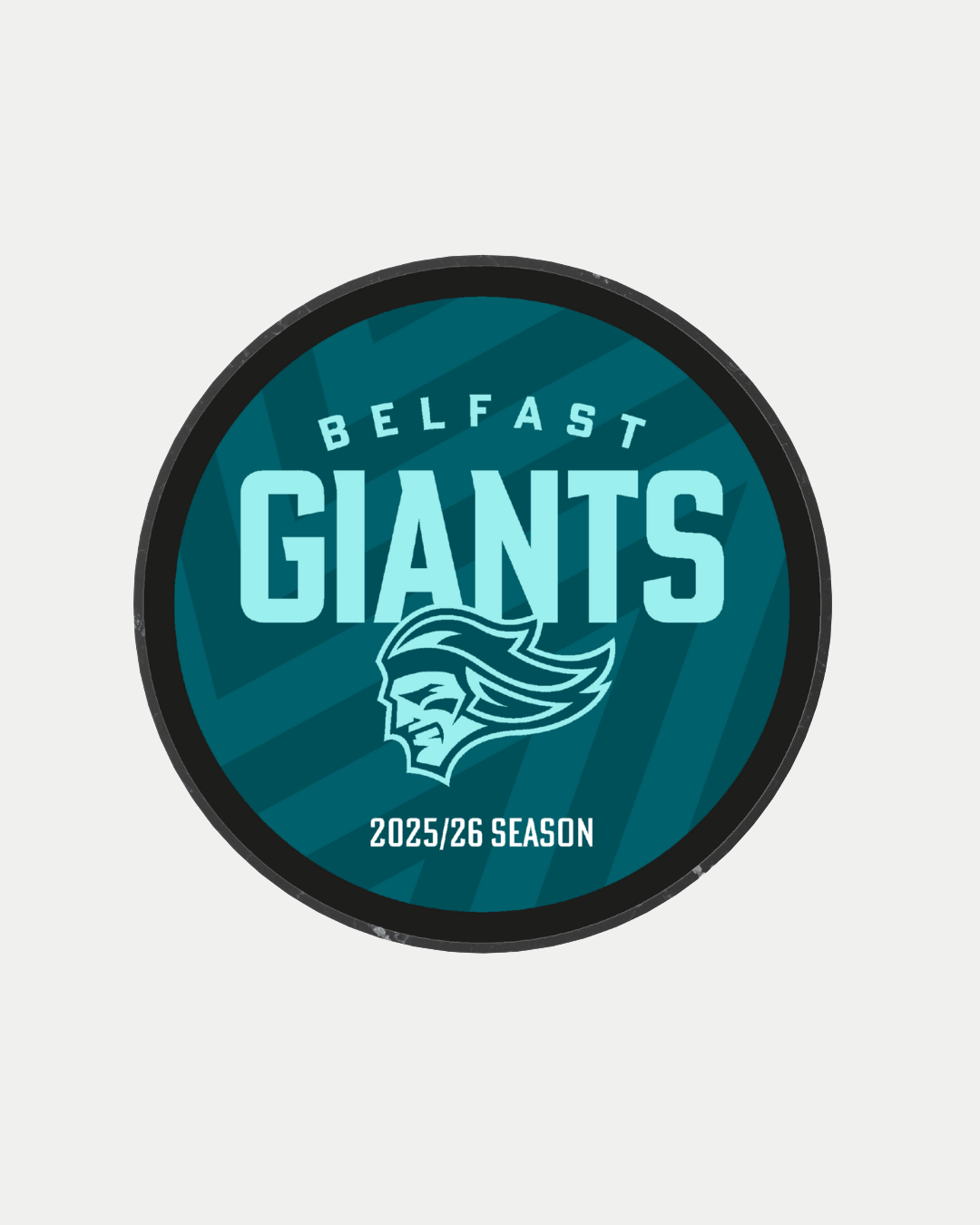 The Logo Season Puck Text 25-26 from Belfast Giants Store by National Merchandise features the Belfast Giants logo with a stylized giant head and "Belfast Giants 2025/26 Season" text on a blue background.