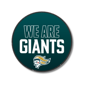 The We Are Giants Logo Puck 25-26 from Belfast Giants Store by National Merchandise features bold white WE ARE GIANTS text above a stylized head with blond hair and a determined look on a circular dark teal background.