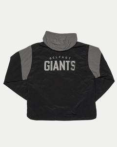 The Belfast Giants Anorak Black by Belfast Giants is a black and grey half-zip jacket featuring a bold grey Giants logo—ideal for cold weather.