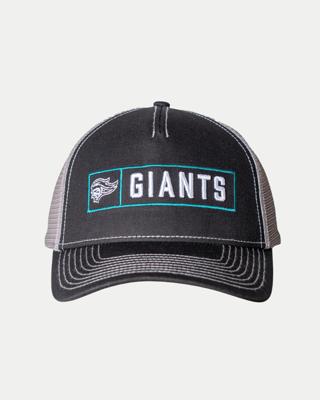 The 25-26 CCM Trucker Cap from the Belfast Giants Store by National Merchandise is a black and gray hat with mesh sides, featuring an embroidered GIANTS logo and a small team emblem on the front panel.