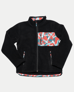 The Belfast Giants Pile Jacket Paint Stripes is a black zip-up fleece-lined jacket with a high collar, abstract red, white, and teal paint-stripe chest pocket featuring "GIANTS" in white to show your team pride.