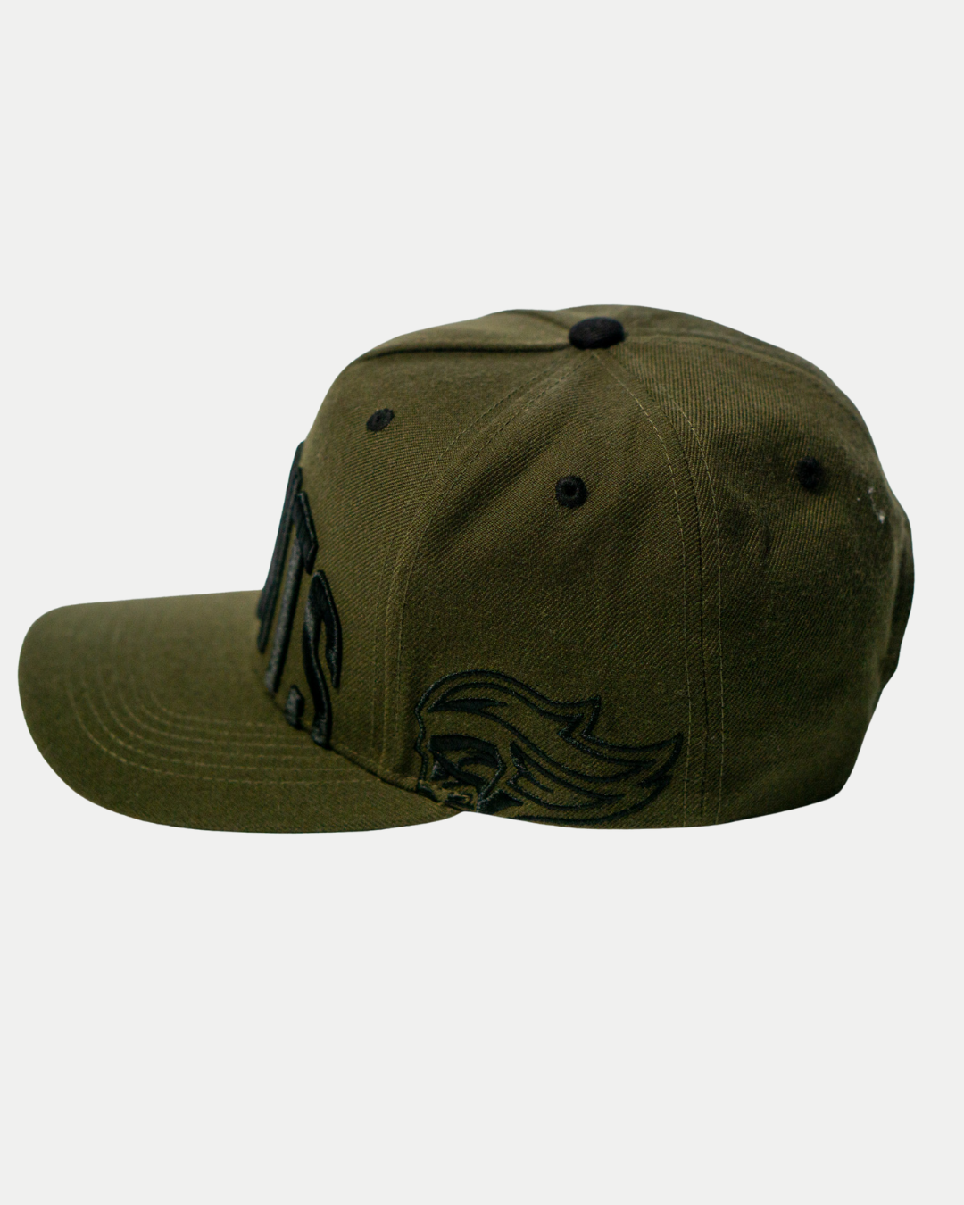 The Belfast Giants Cap Olive by Belfast Giants features black embroidered designs on the front and side, shown from a side angle against a plain white background.