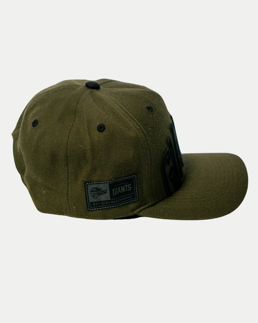 The Belfast Giants Cap Olive by Belfast Giants features an olive green color, black button, flat brim, and a side patch reading “GIANTS Official Merchandise.” Perfect for game day, shown against a plain white background.