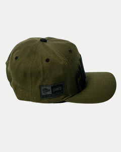 The Belfast Giants Cap Olive by Belfast Giants features an olive green color, black button, flat brim, and a side patch reading “GIANTS Official Merchandise.” Perfect for game day, shown against a plain white background.