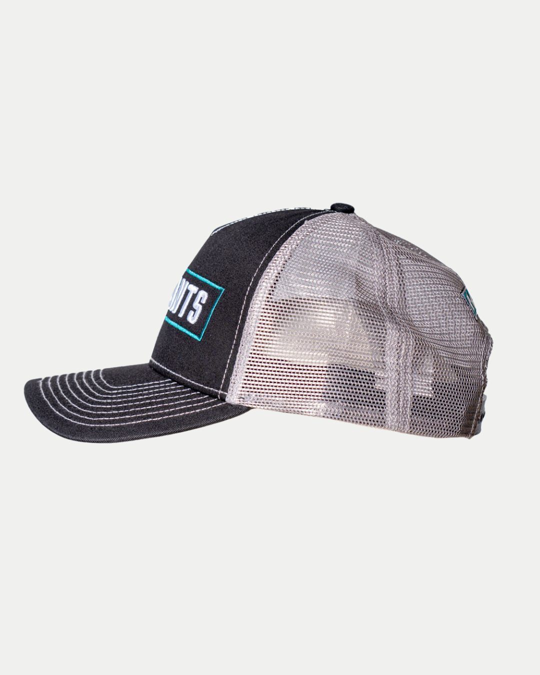 The 25-26 CCM Trucker Cap from Belfast Giants Store by National Merchandise features black and gray mesh, white stitching, and a rectangular front patch, shown in side profile against a plain white background.