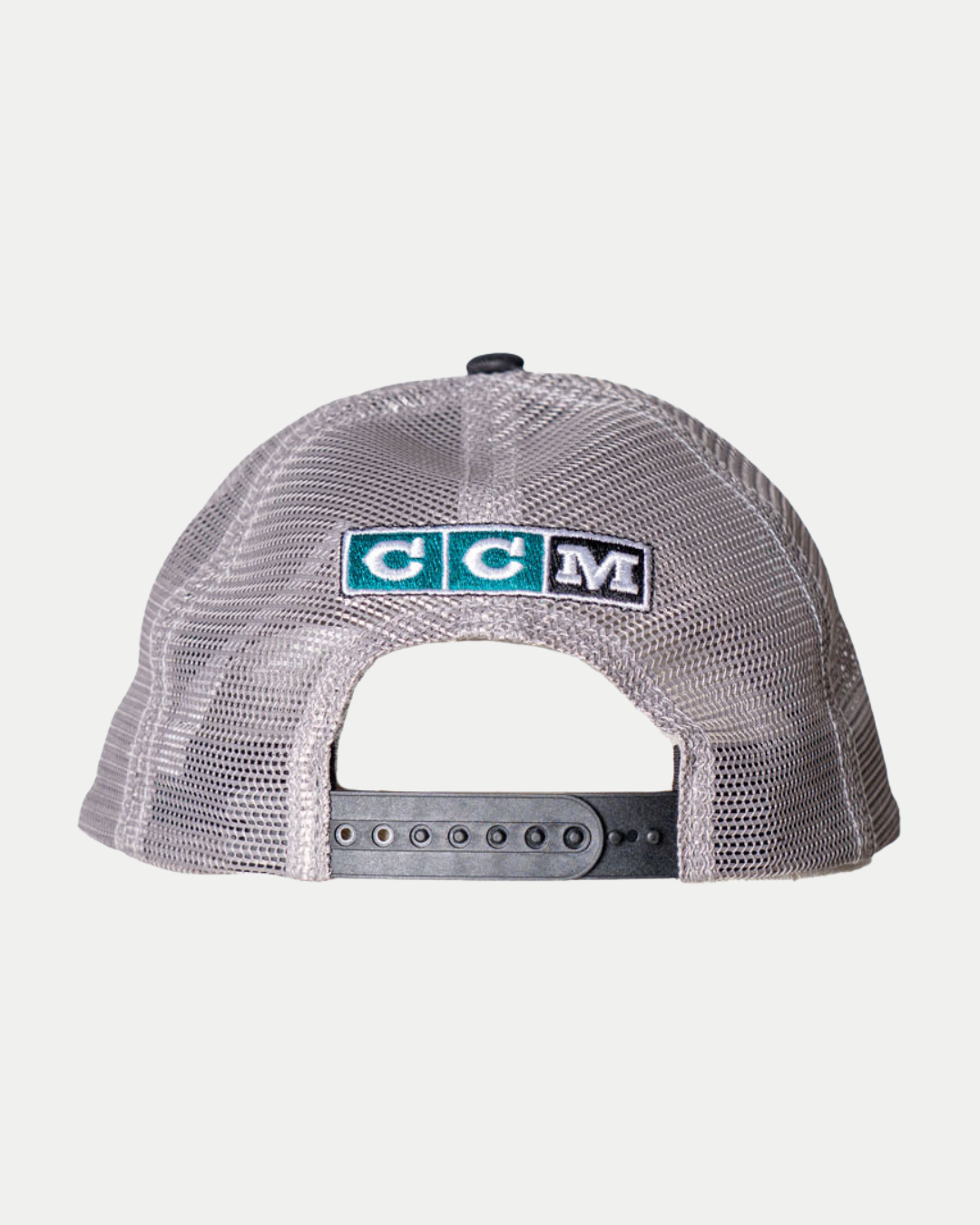 The 25-26 CCM Trucker Cap from Belfast Giants Store by National Merchandise is a grey mesh baseball cap with an adjustable snapback strap and a rectangular CCM logo patch above the back opening.