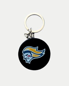 The Belfast Giants Mini Puck Keyring by Belfast Giants Store features a round black design with a stylized face profile in blue, yellow, white, and red accents, attached to a silver keyring.