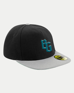 The Belfast Giants BG Logo BLK/Grey Snap Back Cap features a black crown, light gray flat brim, bold teal BG logo on the front, and an authentic yellow sticker on the brim.