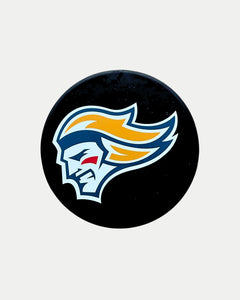 The Belfast Giants Puck Bottle Opener from Belfast Giants Store by National Merchandise is a black hockey puck with a stylized side profile featuring orange hair, a white face, blue accents, and outlined in white and light blue.
